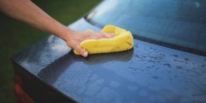Wash someone's car for them